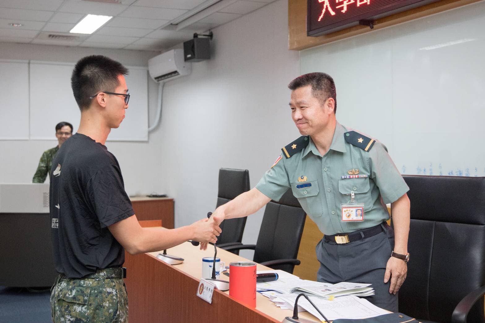 The commander shook hands with cadets