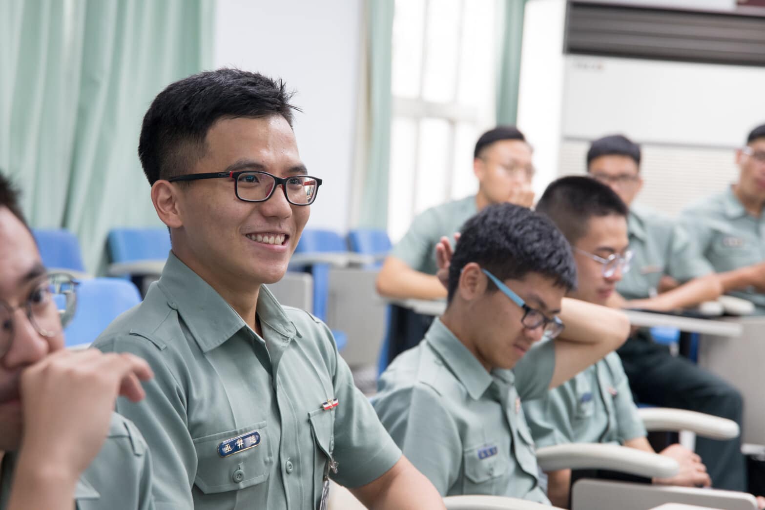 The students listen with focus.