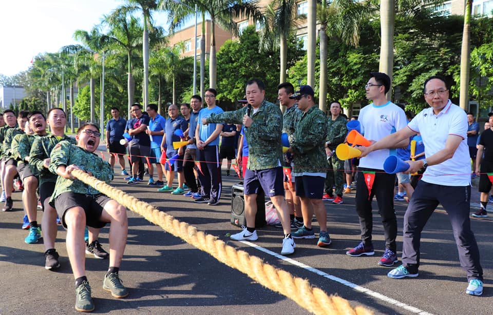 Deputy commander cheers for the tug-of-war