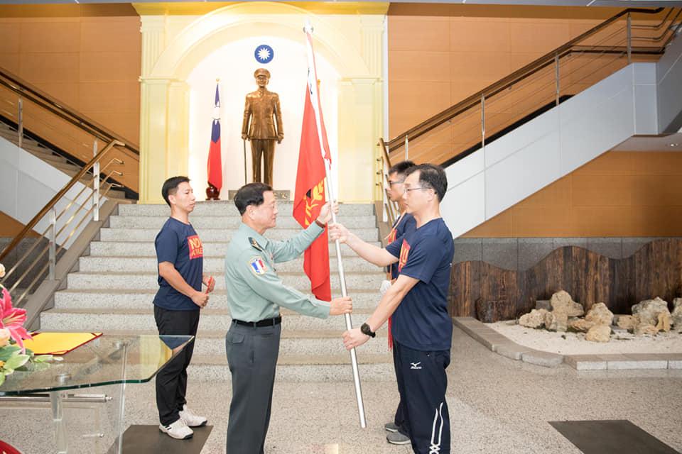 Admiral Wang gave the flags.